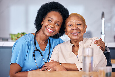 A carer sharing a warm, smiling moment with a client at home